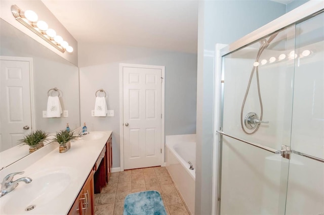 bathroom featuring a stall shower, a sink, and double vanity