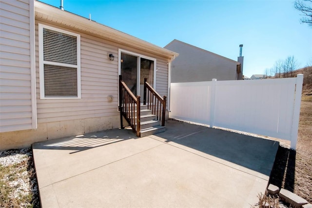 exterior space with entry steps and fence