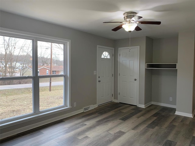 entrance foyer with dark wood-type flooring and ceiling fan