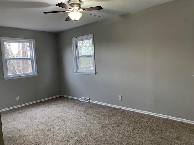 unfurnished room featuring carpet and ceiling fan