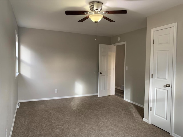 carpeted empty room with ceiling fan