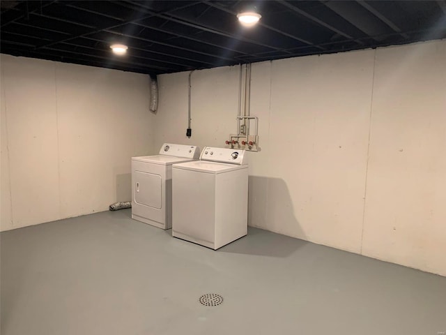 clothes washing area with independent washer and dryer