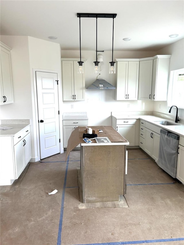 kitchen with sink, decorative light fixtures, a center island, dishwasher, and white cabinets