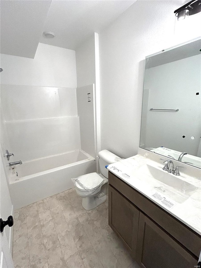 full bathroom with vanity, tub / shower combination, and toilet