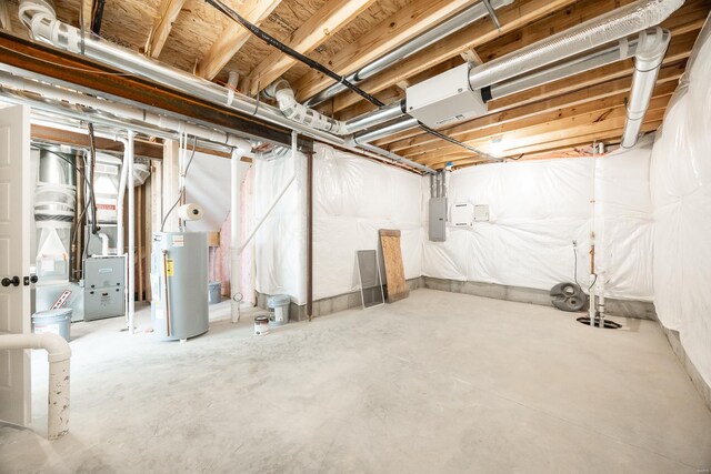 unfinished basement featuring gas water heater and electric panel