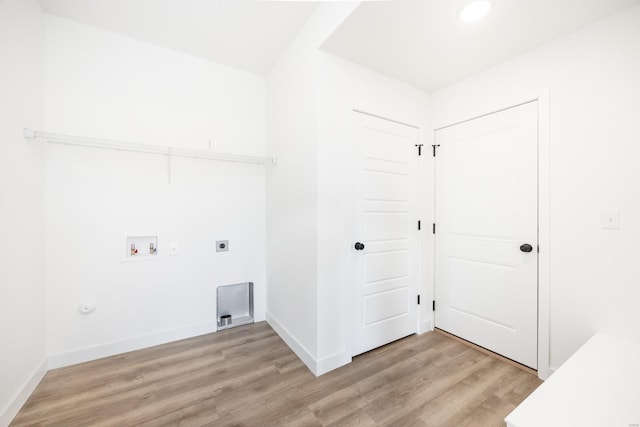 laundry room with electric dryer hookup, light wood-type flooring, baseboards, hookup for a washing machine, and laundry area