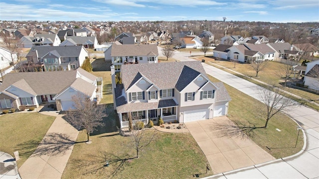 birds eye view of property with a residential view