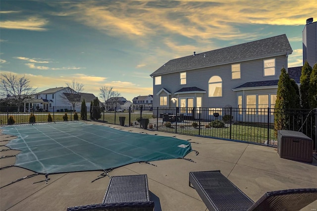 view of pool with a fenced in pool, a residential view, a patio area, and fence