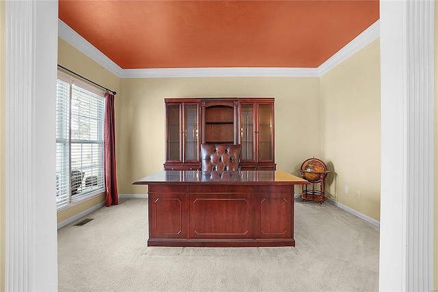 home office featuring light carpet, crown molding, visible vents, and baseboards