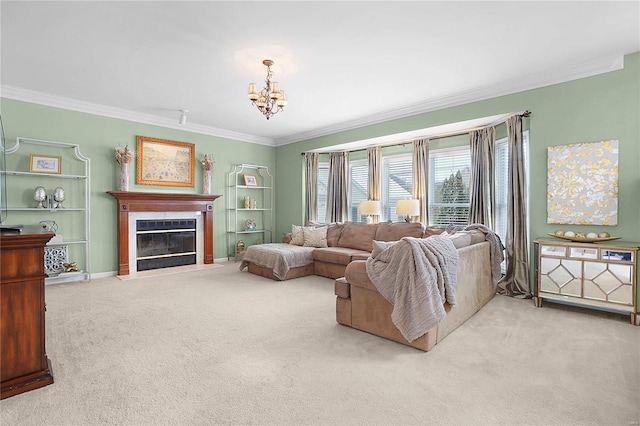 living room with carpet, ornamental molding, a chandelier, and a fireplace with flush hearth