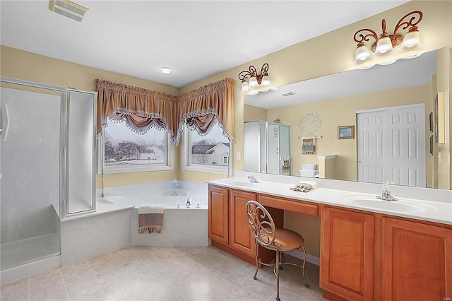 bathroom with a bath, a stall shower, visible vents, and a sink