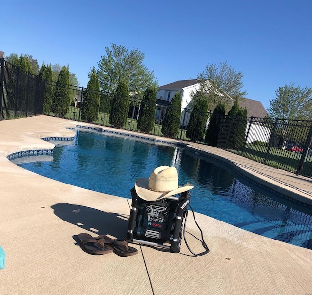 view of pool featuring a patio, fence, and a fenced in pool