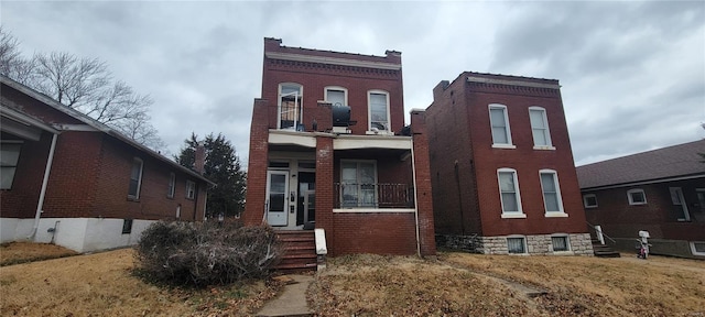 view of front of house with brick siding