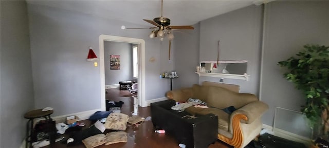 interior space with baseboards and ceiling fan