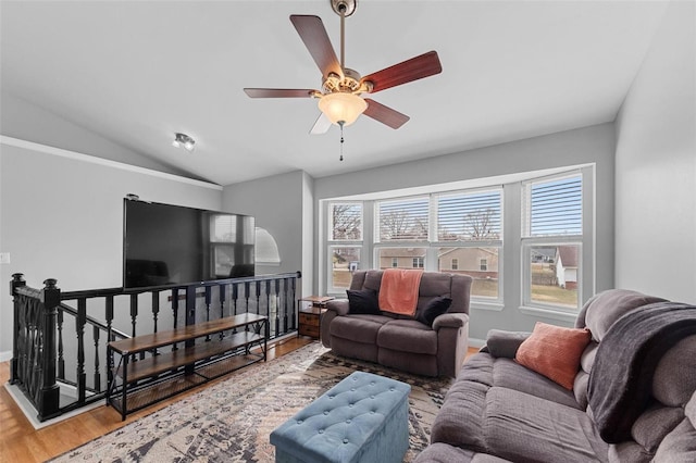 living room with lofted ceiling, ceiling fan, hardwood / wood-style flooring, and a healthy amount of sunlight