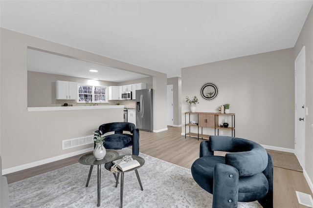 living room with light wood-type flooring