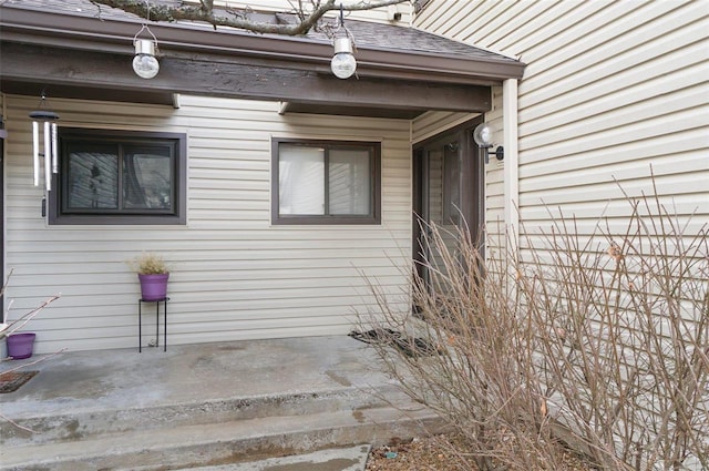 property entrance with a patio area