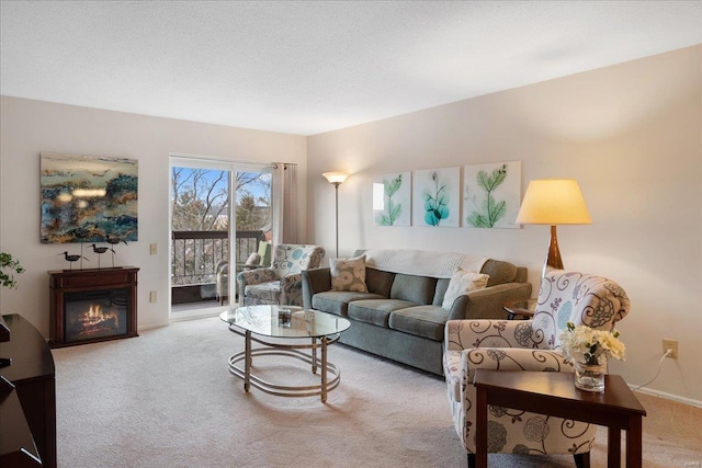 living room with light colored carpet and a textured ceiling