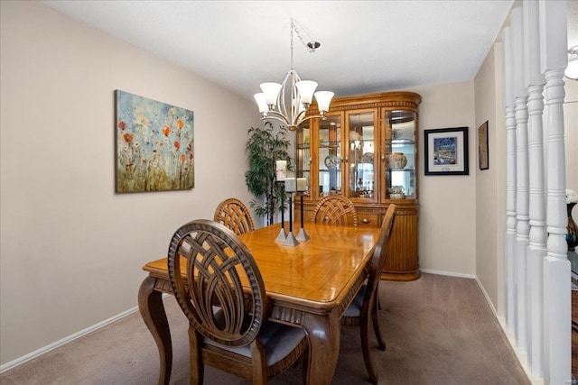 carpeted dining area featuring an inviting chandelier