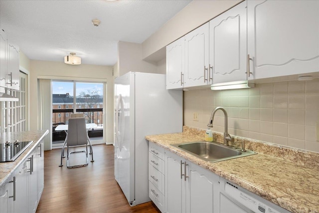 kitchen featuring sink, white appliances, white cabinetry, backsplash, and dark hardwood / wood-style flooring