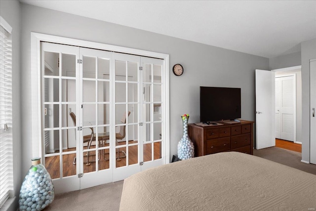 bedroom featuring french doors and carpet flooring