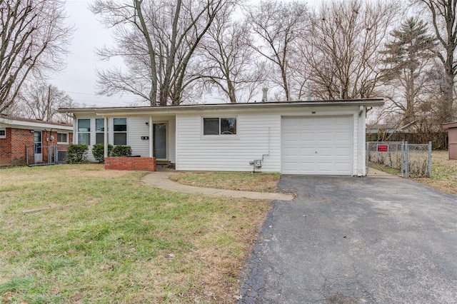 single story home featuring a garage and a front lawn