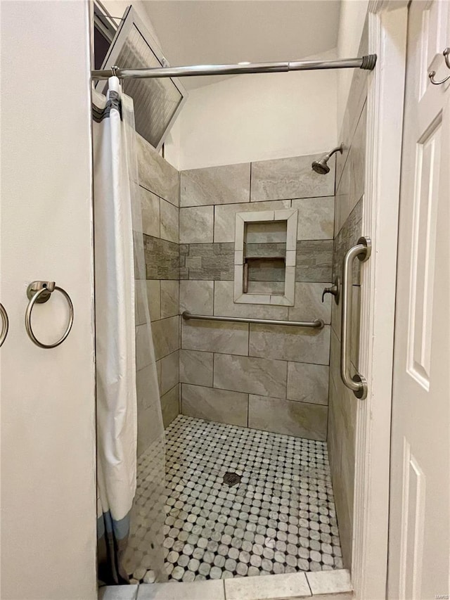 full bathroom with tiled shower