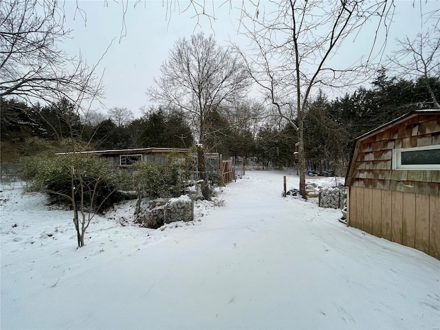 view of yard layered in snow