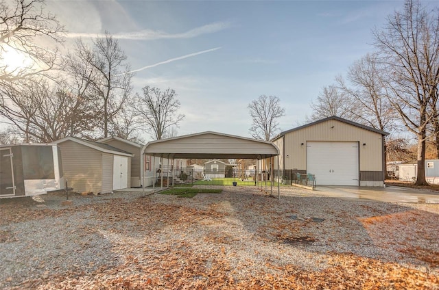 ranch-style home with an outbuilding, a carport, and a garage