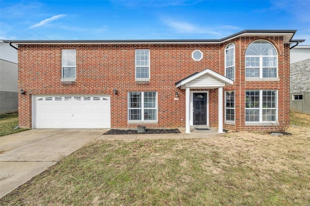 view of front of property with a garage and a front lawn