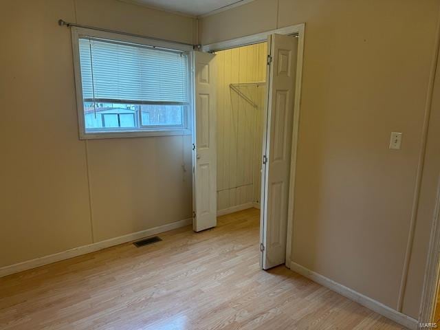 unfurnished bedroom featuring light wood-type flooring