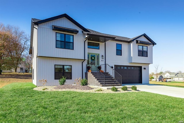 view of front of house with a garage and a front yard