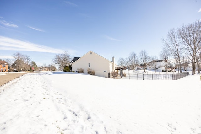 view of yard layered in snow