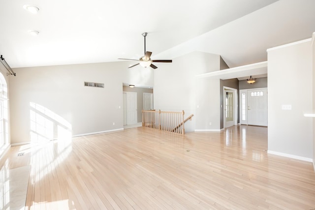 interior space with ceiling fan, high vaulted ceiling, and light hardwood / wood-style floors