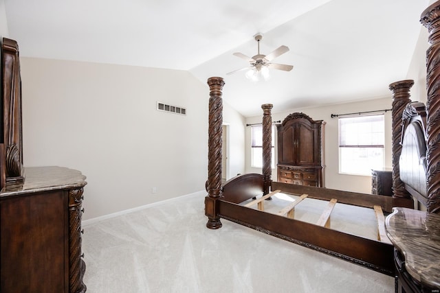 bedroom featuring light carpet, multiple windows, lofted ceiling, and ceiling fan