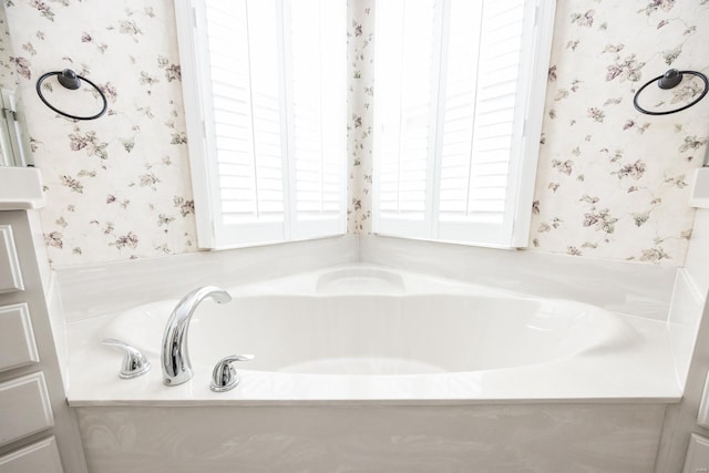 bathroom with a tub