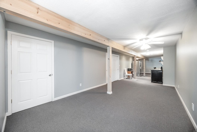 basement featuring carpet and a textured ceiling