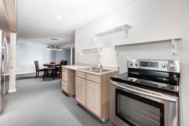 kitchen featuring light colored carpet, decorative light fixtures, electric stove, sink, and light brown cabinetry