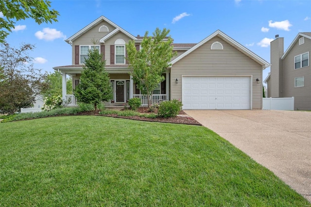 traditional-style house featuring a garage, concrete driveway, covered porch, and a front yard