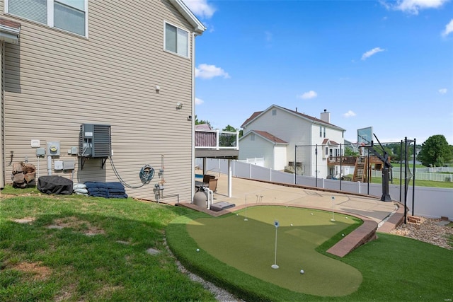 exterior space with a lawn, a patio area, and fence