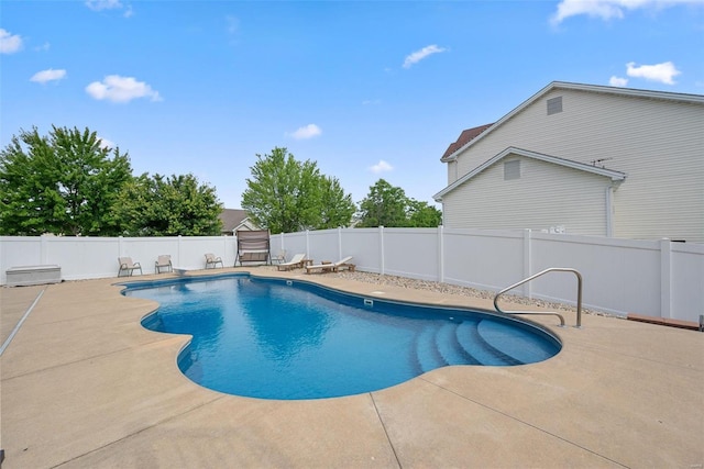 view of swimming pool with a patio area, a fenced backyard, and a fenced in pool