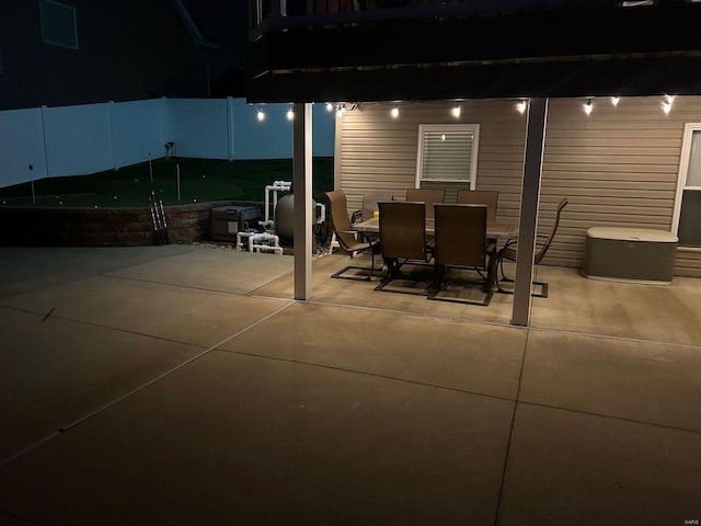 view of patio featuring fence and outdoor dining area