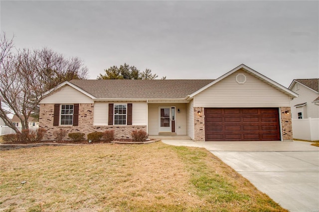 ranch-style house featuring a garage and a front yard