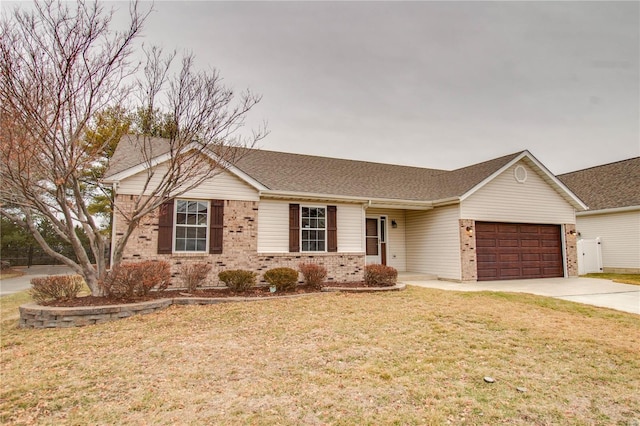 ranch-style house featuring a garage and a front lawn