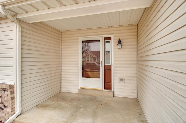 doorway to property featuring a patio area