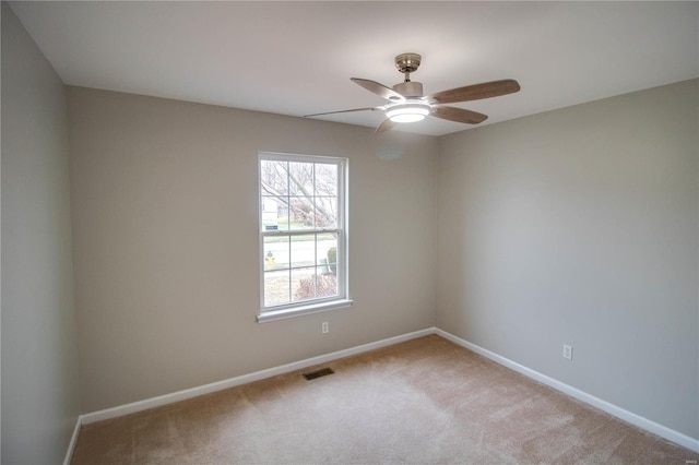 empty room with carpet floors and ceiling fan