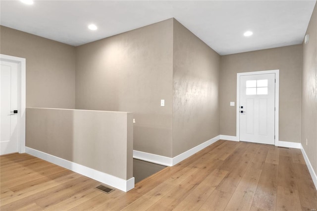 foyer with light wood-type flooring