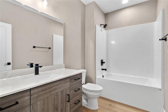 full bathroom with vanity, toilet, bathing tub / shower combination, and hardwood / wood-style floors