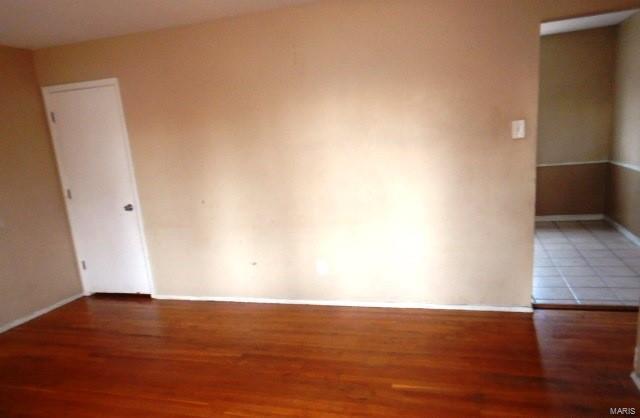 spare room featuring hardwood / wood-style flooring