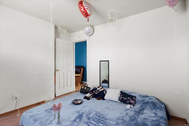 bedroom featuring a textured ceiling